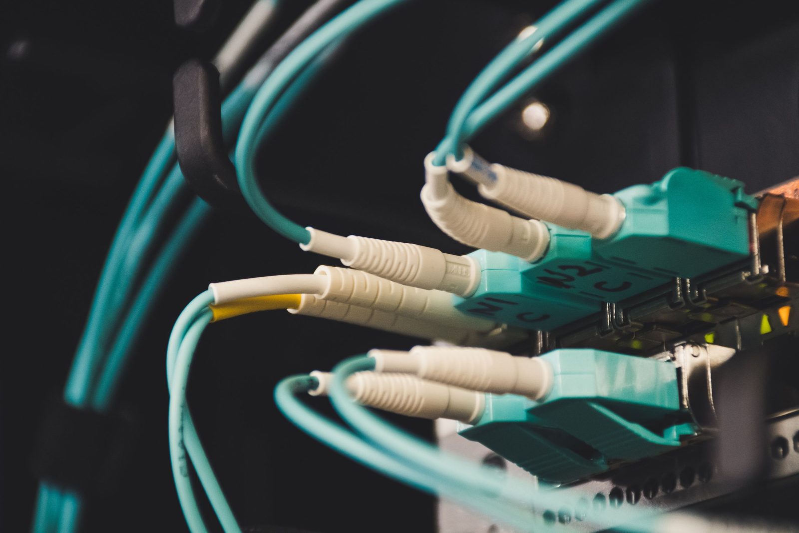 Duplex LC fibre connectors seated into a transceiver on a switch line card