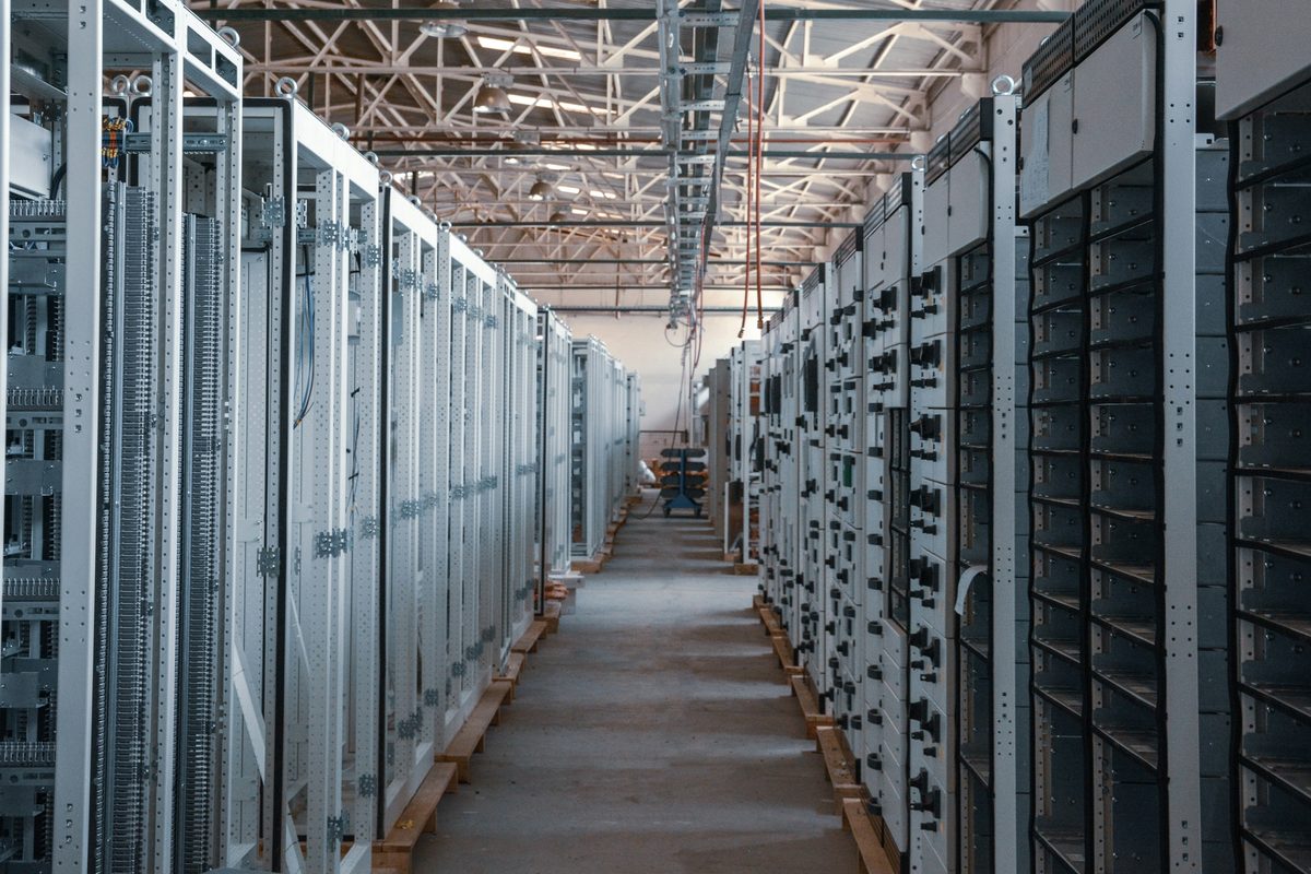 A lit aisle between metal cabinet rows