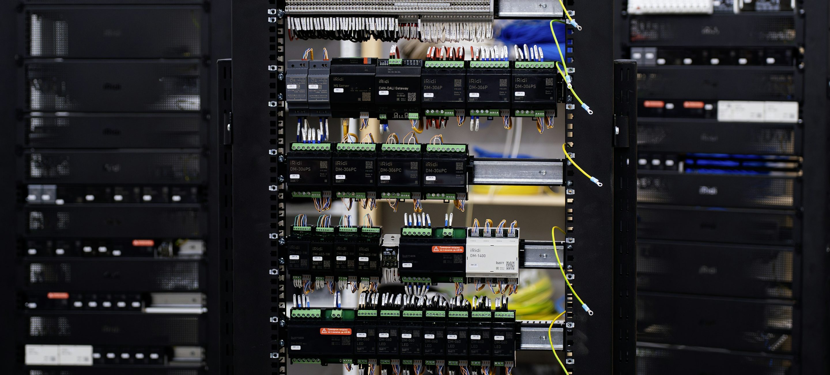 A rack elevation photographed straight on, with equipment, patch fields and cabling across every unit