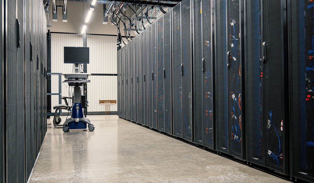 A data hall aisle with cabinets on both sides and space still available