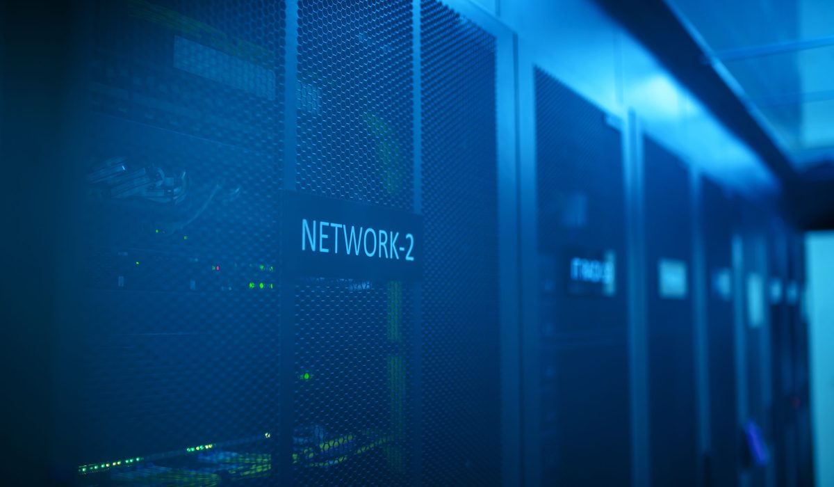 A labelled cabinet row lit blue in a production data hall
