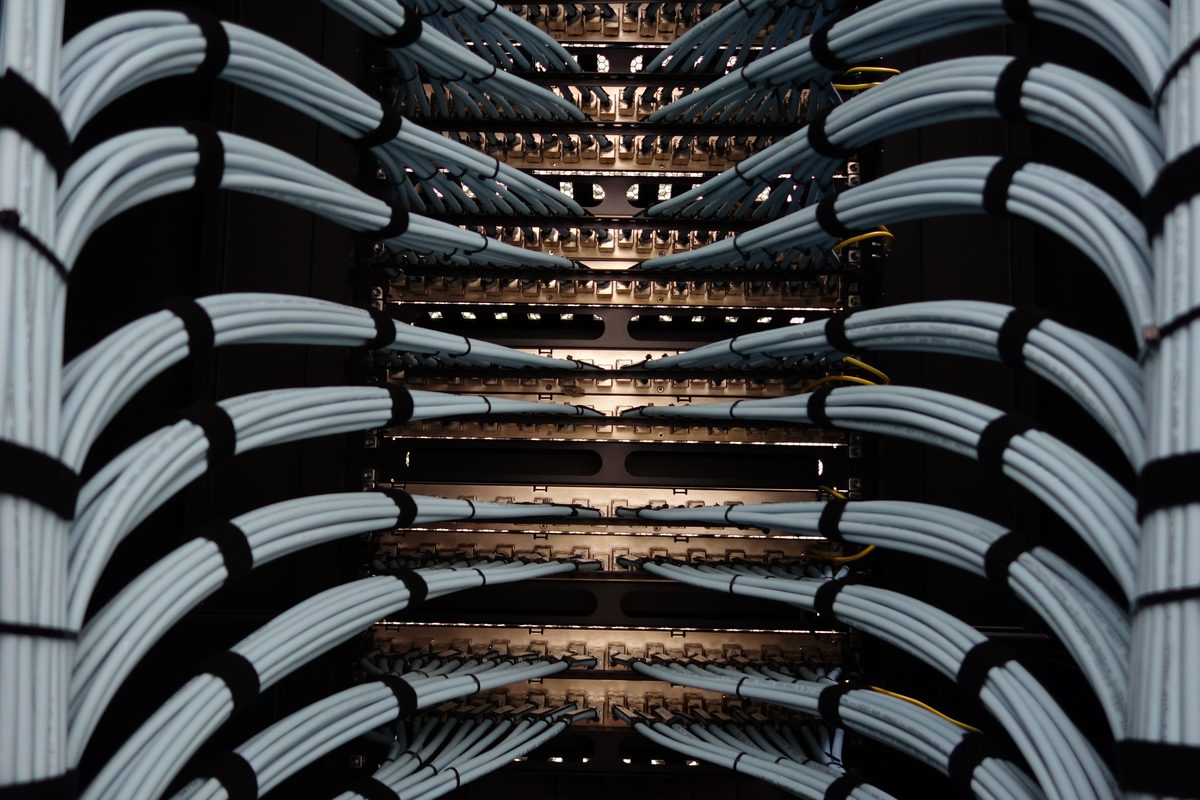 Structured cabling combed out across a bank of patch panels