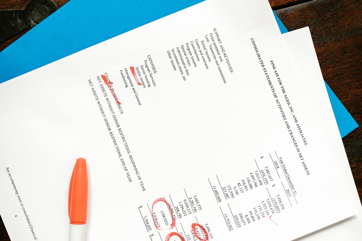A marked-up written record on a desk during an evidence review