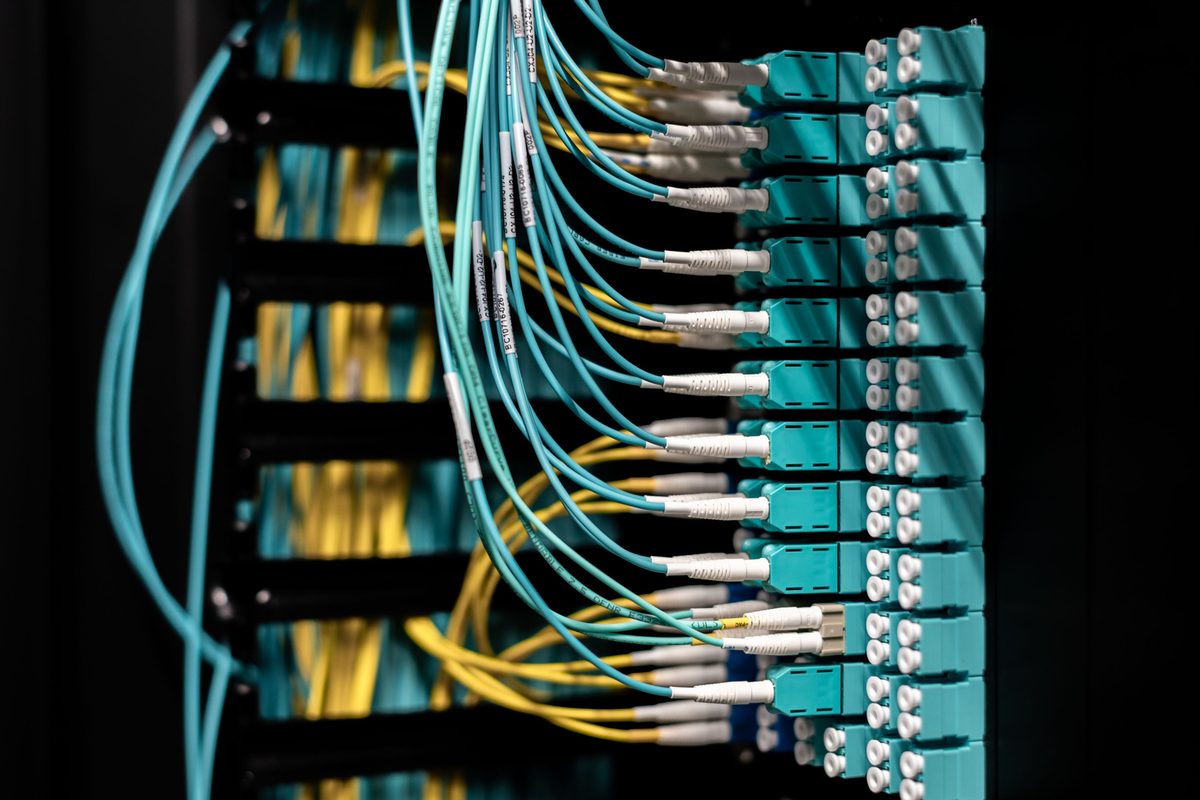 Labelled fibre cabling terminated across a patch panel