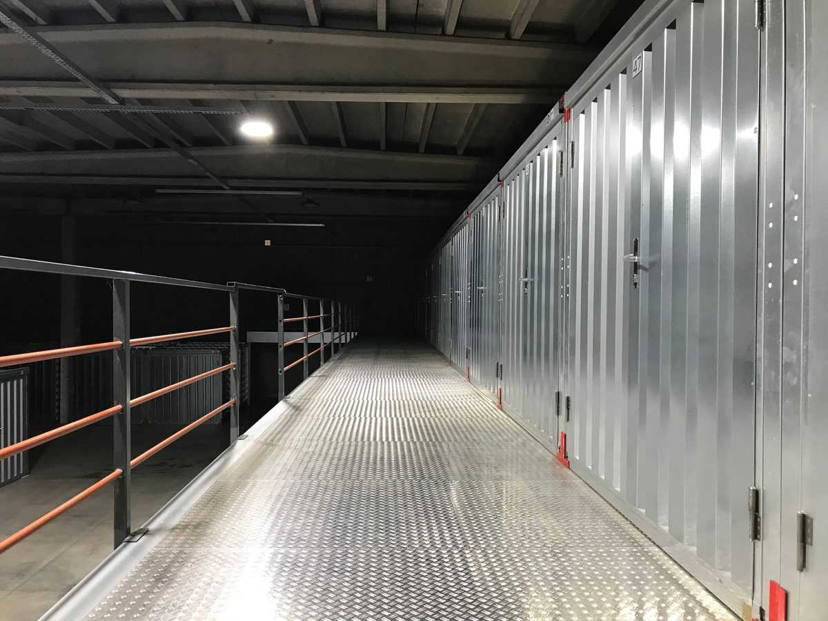 A darkened corridor of sealed steel doors with no external access